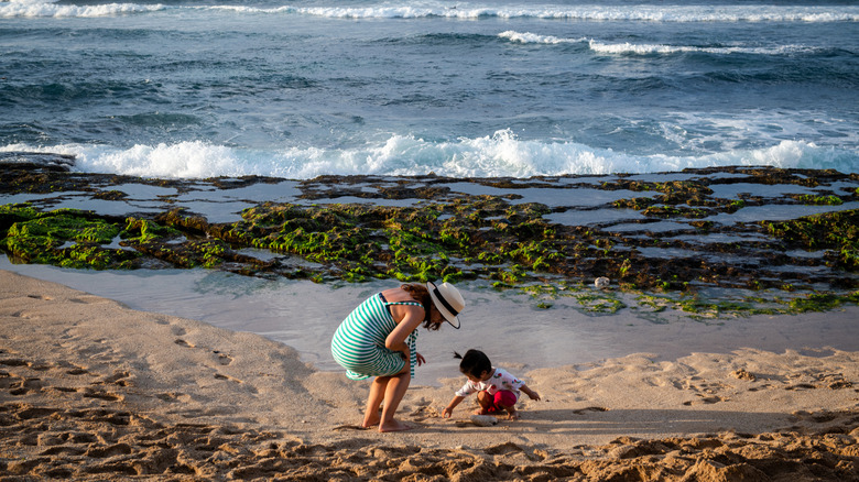 mother and child on beach