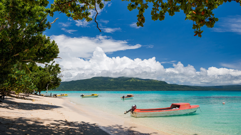 bright canoes in Vanuatu waters