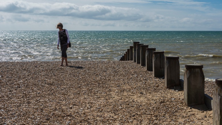 Camber Sands, England, woman walking