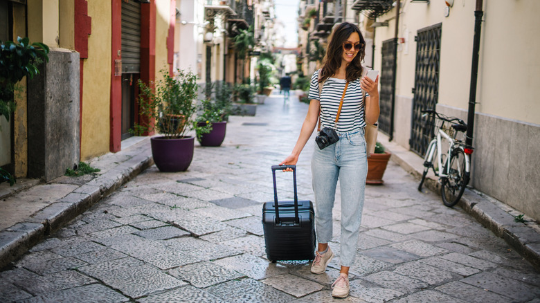 person with luggage in Italy