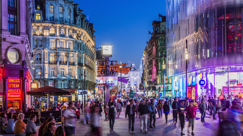 Neon lights and crowds on a London night