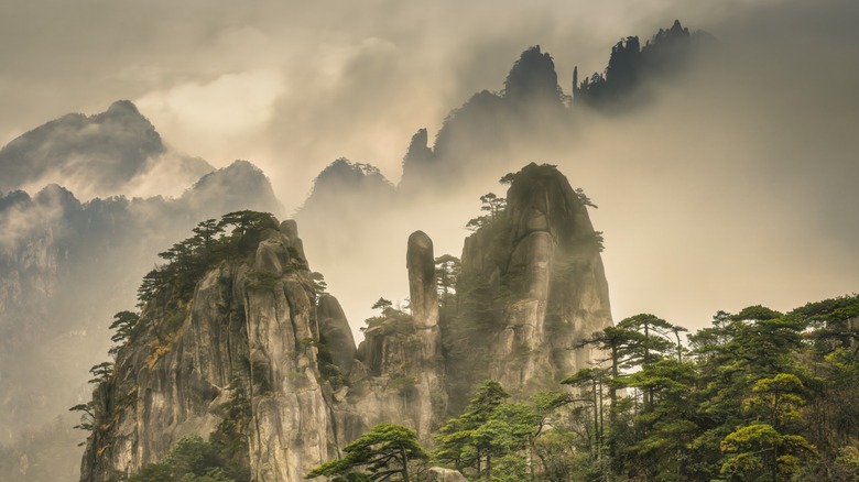 The Huangshan mountains, shrouded by mist and clouds, in the early morning in Anhui, China