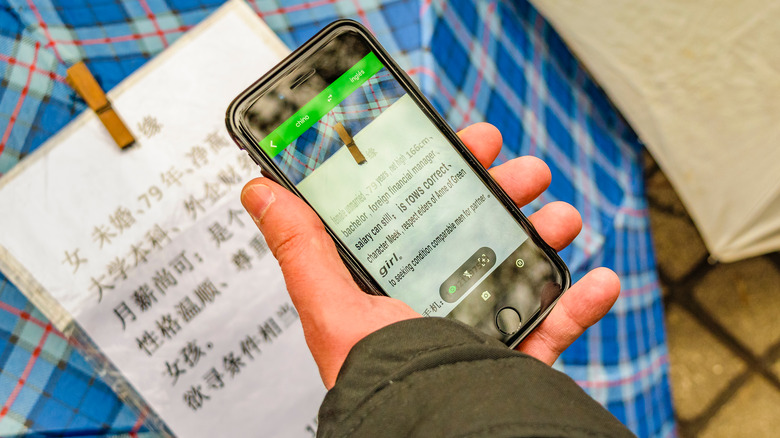 Person using Google Translate phone feature