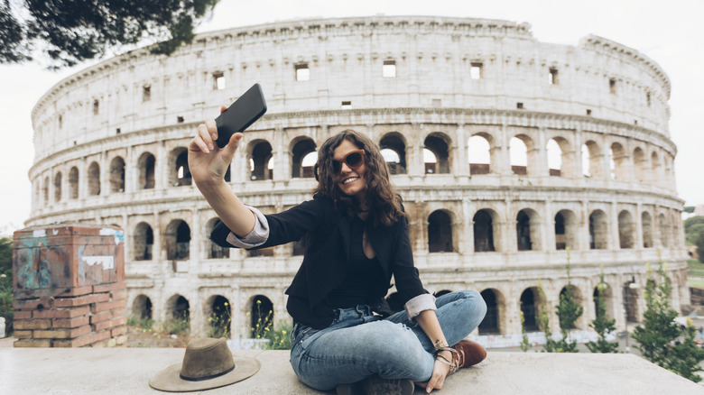 Traveler taking a selfie at the Colosseum