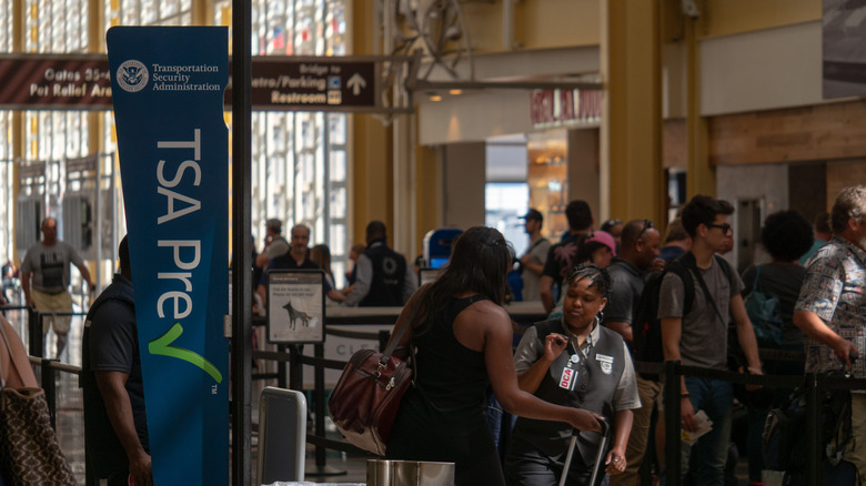 People going through the TSA PreCheck line at an airport