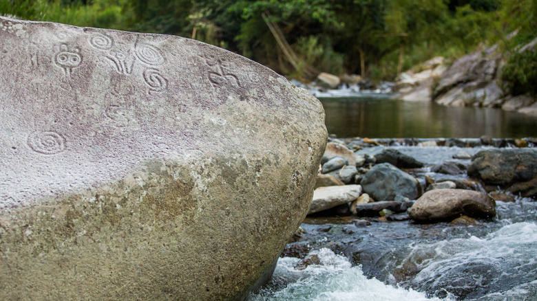 Ancient carved figures Piedra Escrita in Jayuya, Puerto Rico