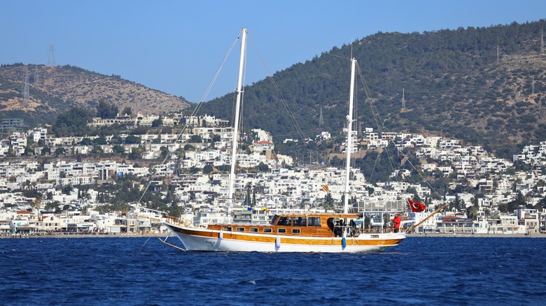 Turkish gulet sailing past coast