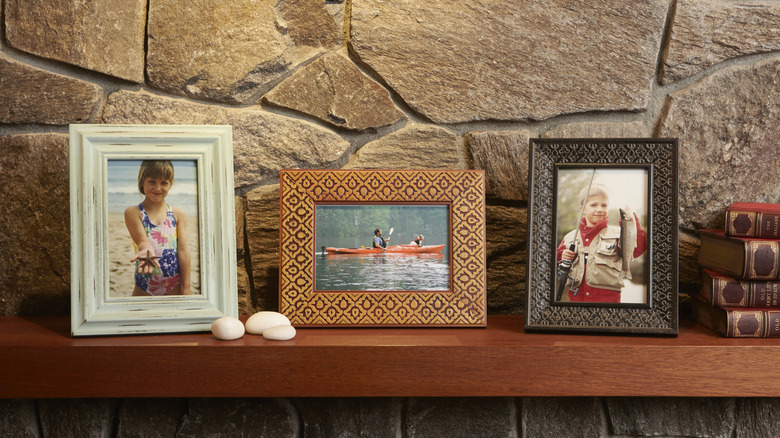 Framed photos on shelf