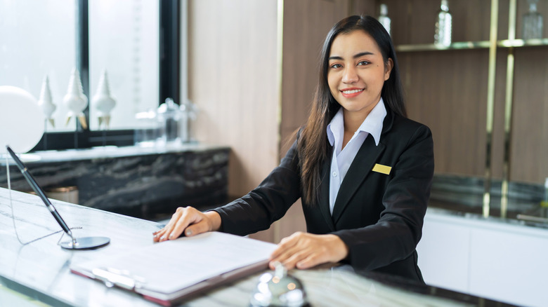 Woman at hotel front desk