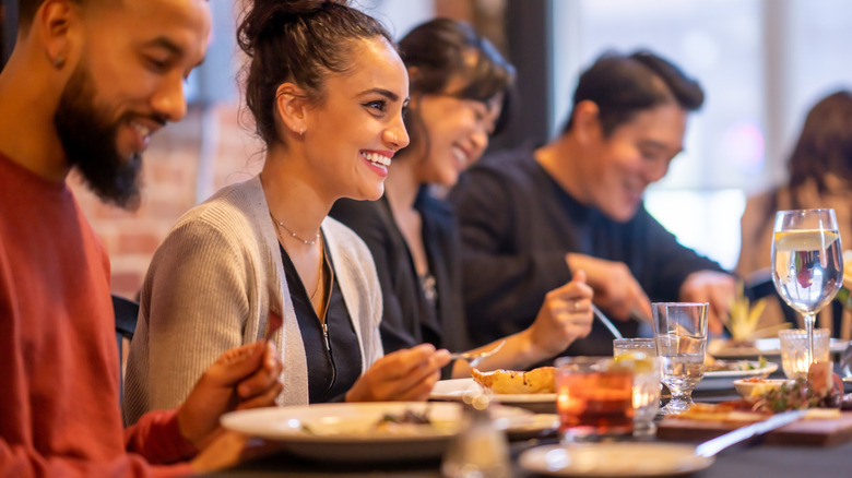 People dining at a restaurant on vacation