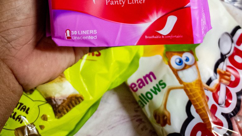 Panty liners pack in someone's hand