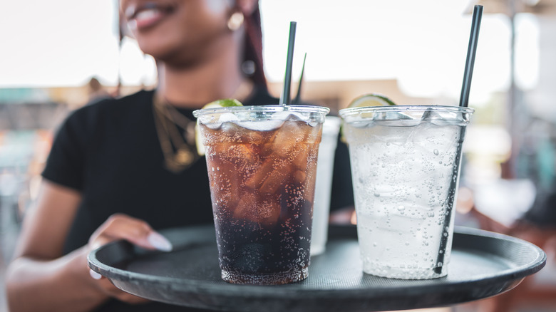 Server bringing an icy drink