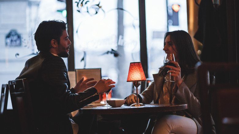 couple talking in Paris restaurant 