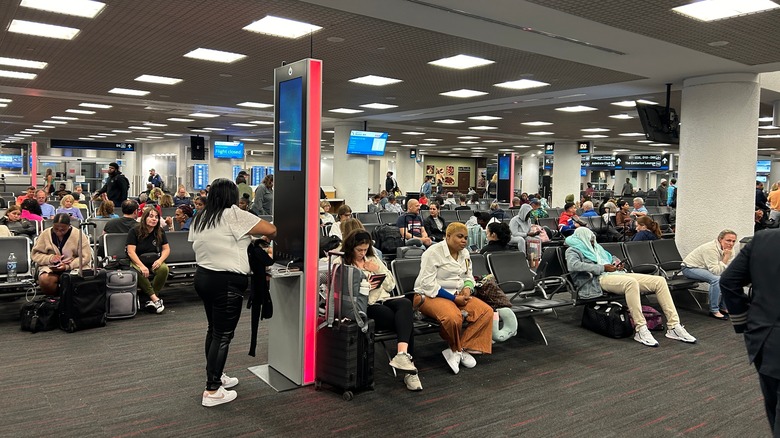 Travelers waiting for their flight at Miami International