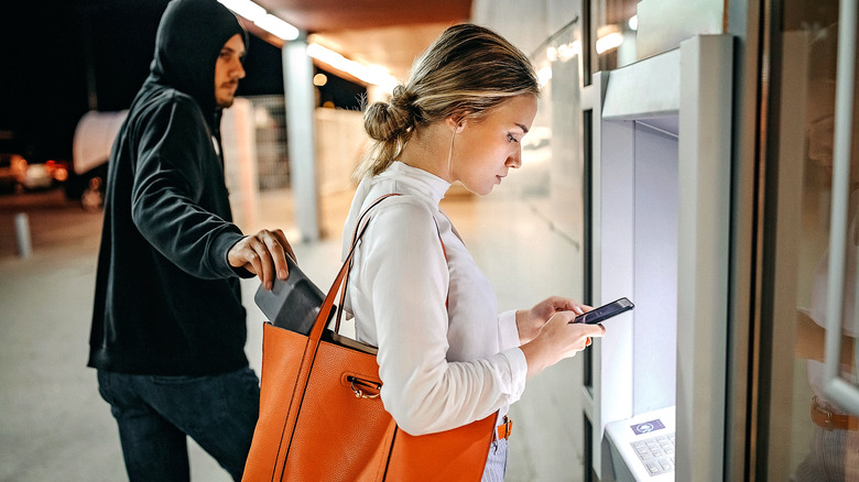 Woman being pickpocketed