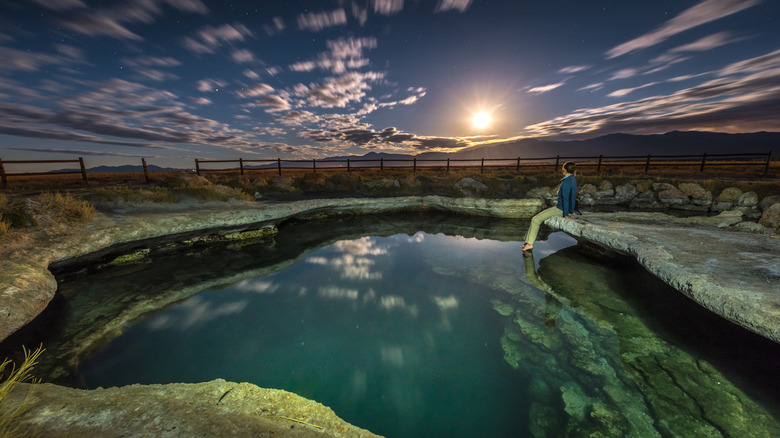 A person sitting near the Meadow Hot Springs