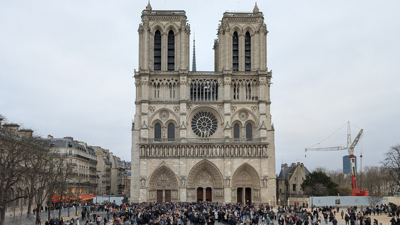 Crowds amassing outside Notre Dame cathedral in Paris