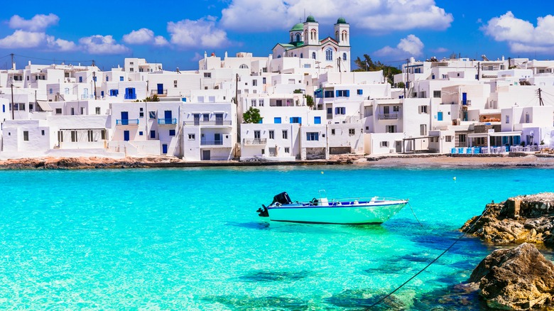 White buildings over blue water in Naoussa, Paros