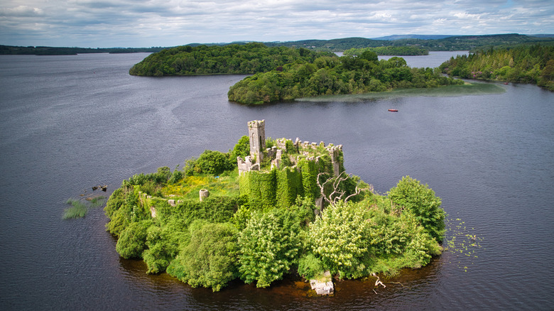 McDermott's Castle on a green island in the middle of Lough Key