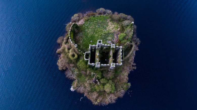 Aerial view of McDermott's Castle surrounded by water