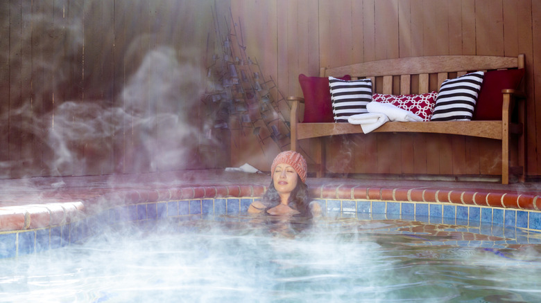 Woman relaxing in a hot spring in New Mexico