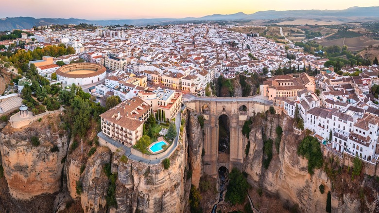 Cliffside town with a massive bridge.