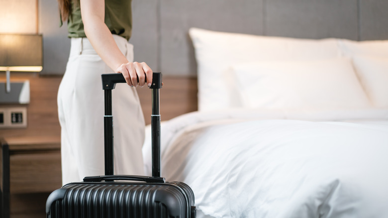 Woman standing in a hotel room