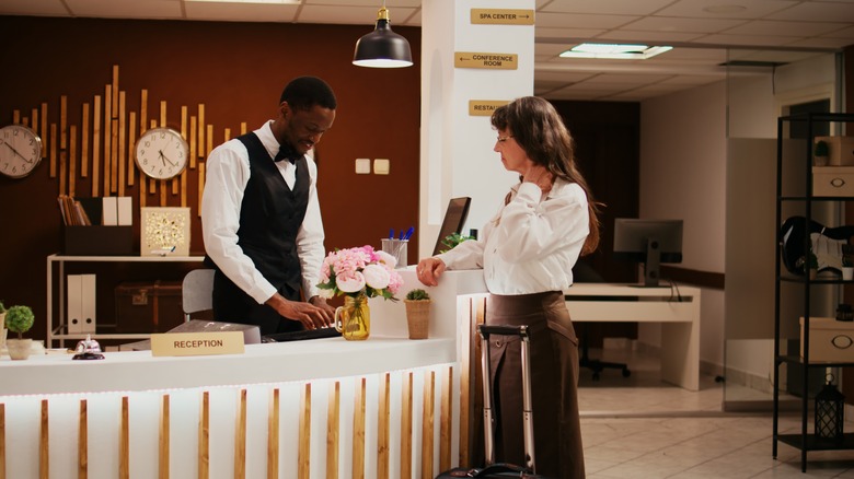 Hotel concierge helping a guest