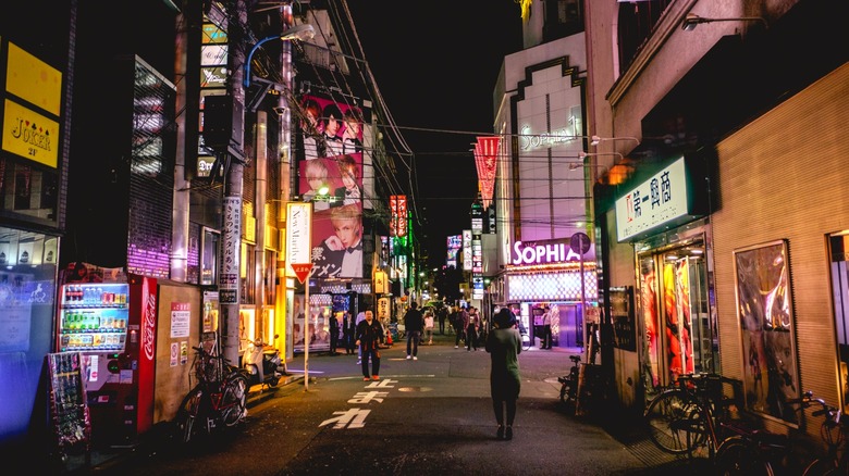 Japanese urban scene with bright lights and signage