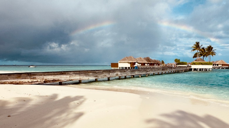 rainbow over maldives beach