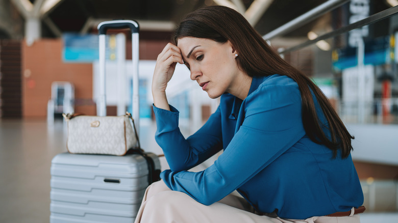 A stressed woman who just missed her flight