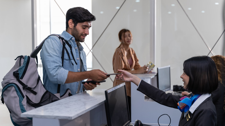 Person presenting passport for inspection