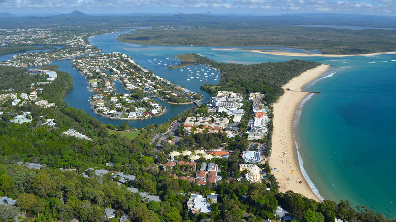 Aerial view of Noosa Main Beach with coastal communities in backdrop