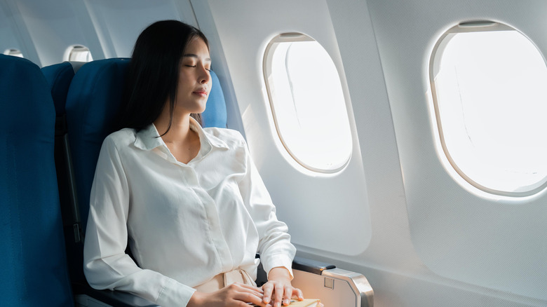 Relaxed woman on a plane