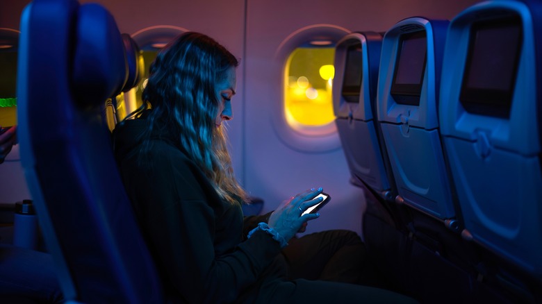 Person using phone in-flight