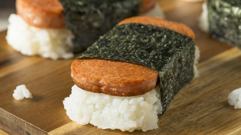 Close up of Spam musubi on a wooden surface