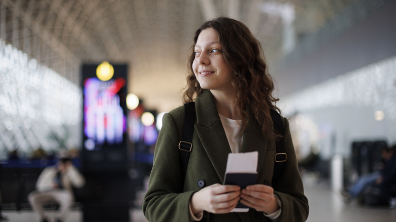 woman holding her passport