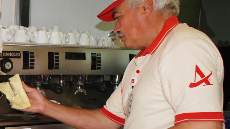 Italian Autogrill barista getting coffee