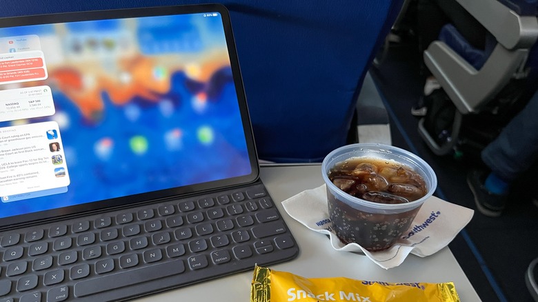Soda, snacks, computer on plane