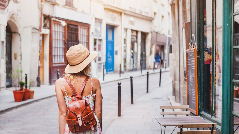 Female solo traveler on street in Paris