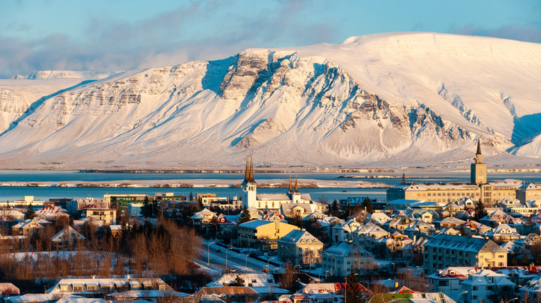 View over Reykjavík, Iceland with buildings and snowy mountain the background