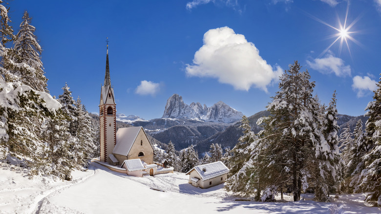 snowy italian chapel mountains