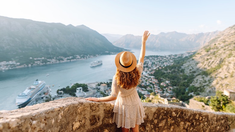 A female tourist admires a view in Europe