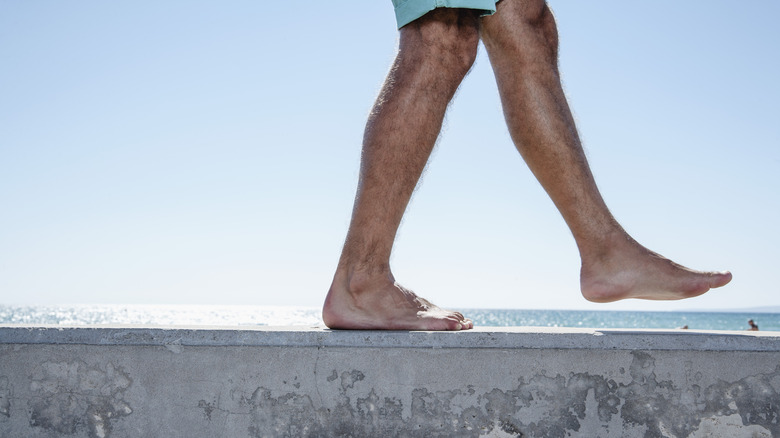 Person walking barefoot