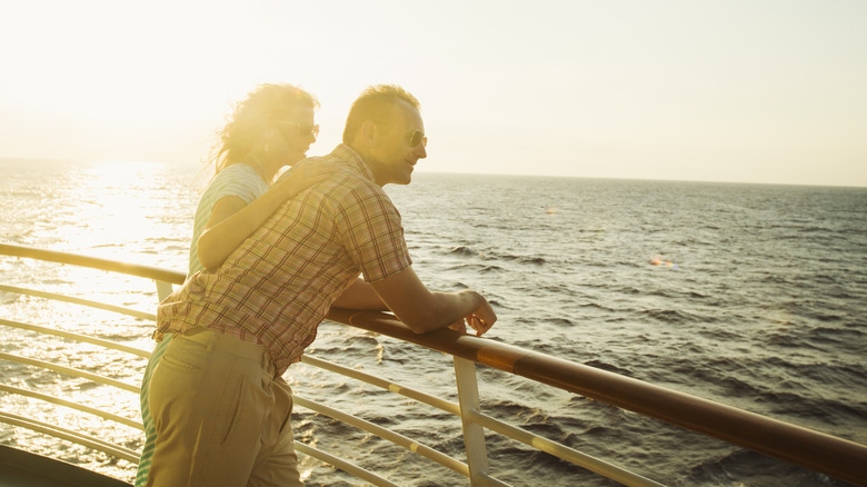 A couple hanging out on a ship deck