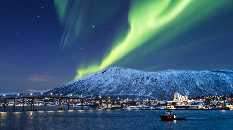 Northern lights over port of Arctic city.