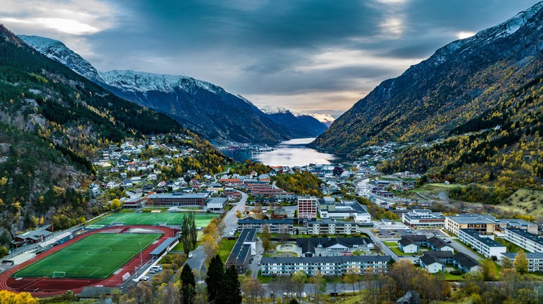 Town of Odda by Norweigan fjord in mountain valley.