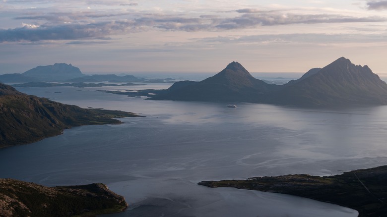 A cruise ship making its way through Norwegian fjords