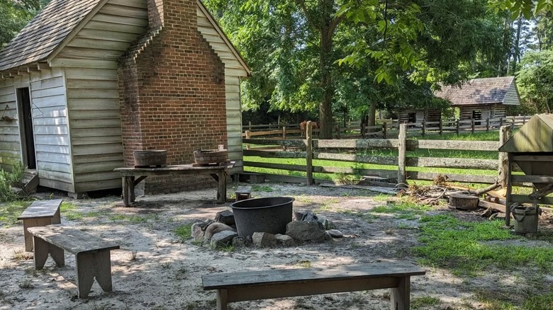 An old farm structure and firepit at Island Farm in Mateo, North Carolina