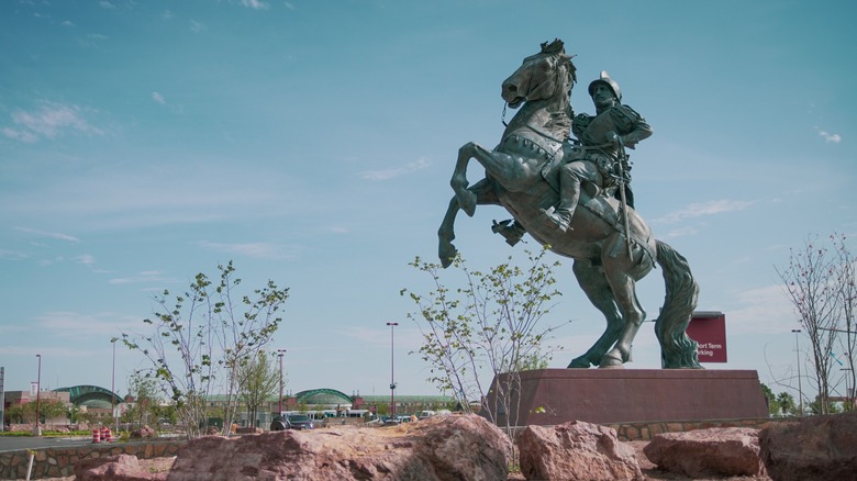 A bronze equestrian statue in El Paso in daylight